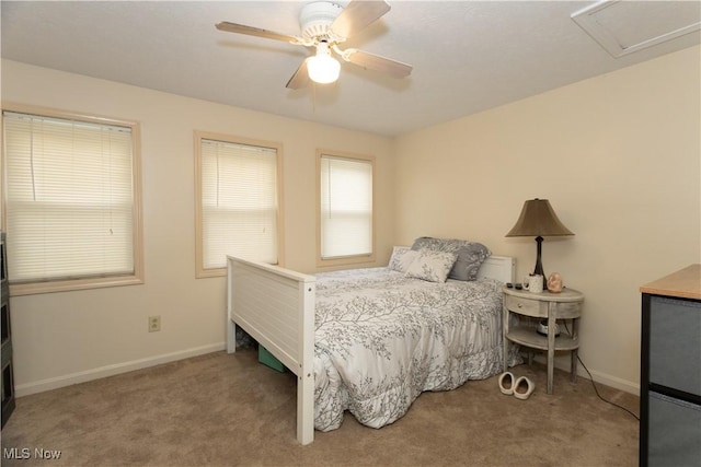 bedroom with ceiling fan and light colored carpet