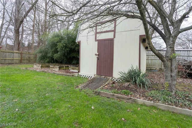 view of outdoor structure featuring a lawn