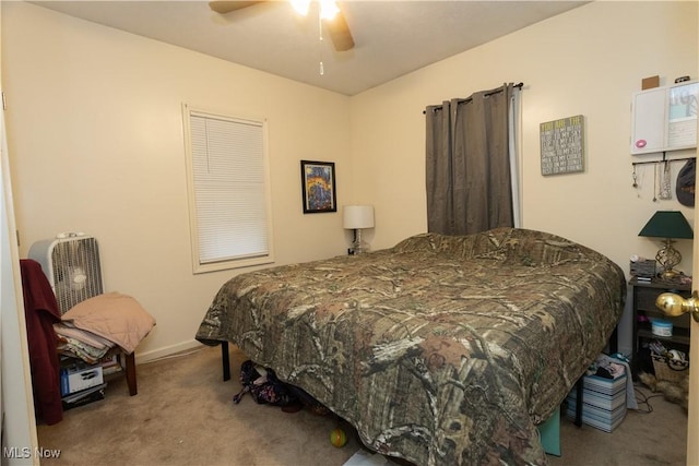 carpeted bedroom featuring ceiling fan