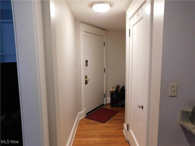 corridor featuring light wood-type flooring