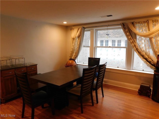 dining area featuring light wood-type flooring