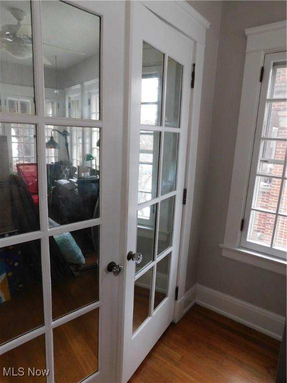 doorway to outside featuring hardwood / wood-style flooring, french doors, and a healthy amount of sunlight