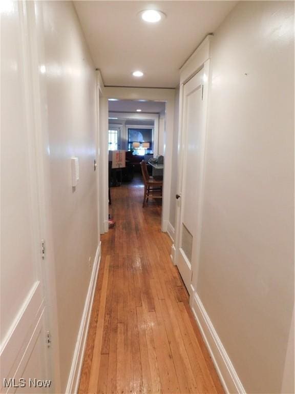 hallway featuring hardwood / wood-style floors