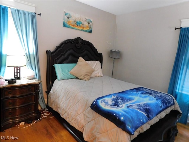 bedroom featuring wood-type flooring