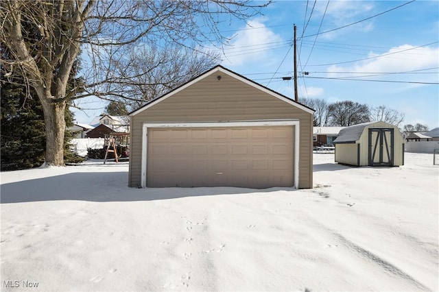 view of snow covered garage