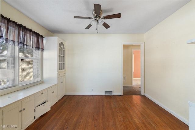 spare room with hardwood / wood-style flooring and ceiling fan