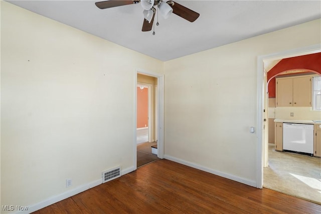 spare room featuring ceiling fan and hardwood / wood-style floors