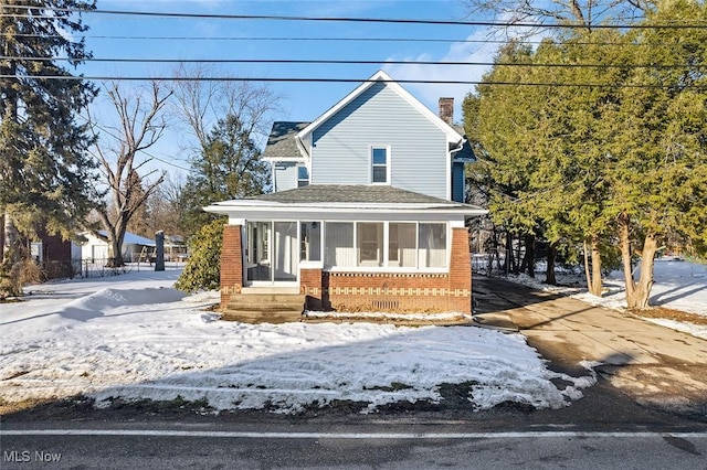 view of front of home with a sunroom