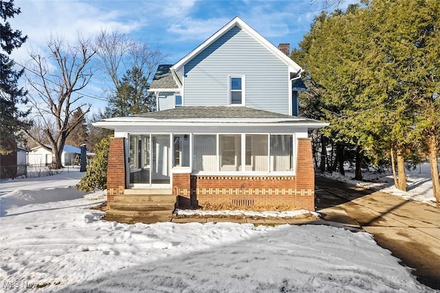 view of property featuring a sunroom