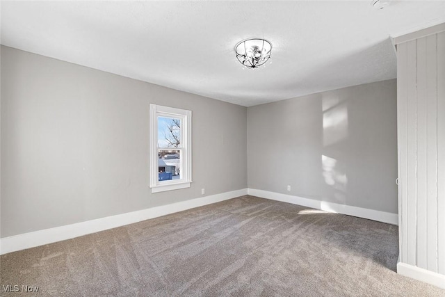 unfurnished room featuring carpet flooring