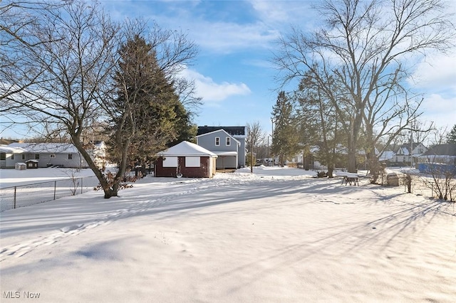 view of yard layered in snow