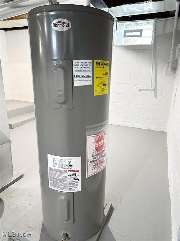 utility room featuring electric water heater