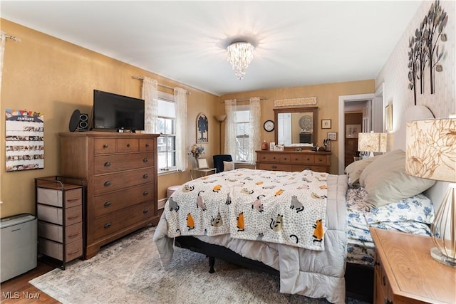 bedroom with hardwood / wood-style flooring