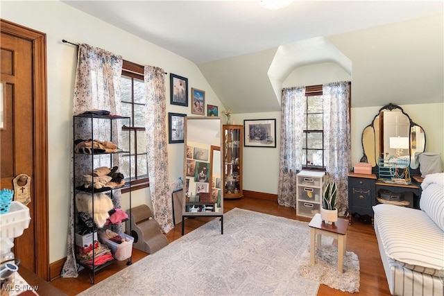 sitting room with vaulted ceiling and hardwood / wood-style floors