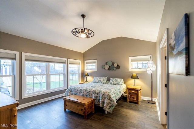 bedroom with lofted ceiling and dark hardwood / wood-style flooring