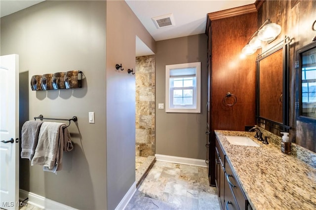 bathroom featuring walk in shower and vanity