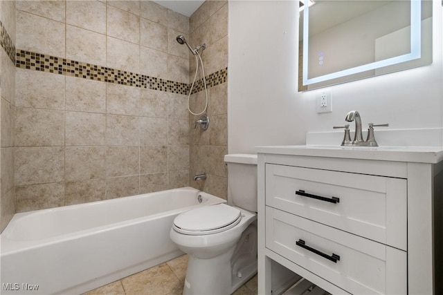 full bathroom with toilet, vanity, tile patterned flooring, and tiled shower / bath combo