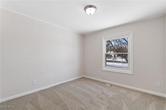 unfurnished room featuring carpet