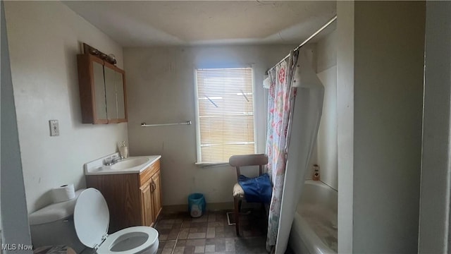 full bathroom featuring toilet, vanity, and shower / bath combination with curtain