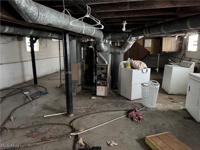 basement with separate washer and dryer and fridge