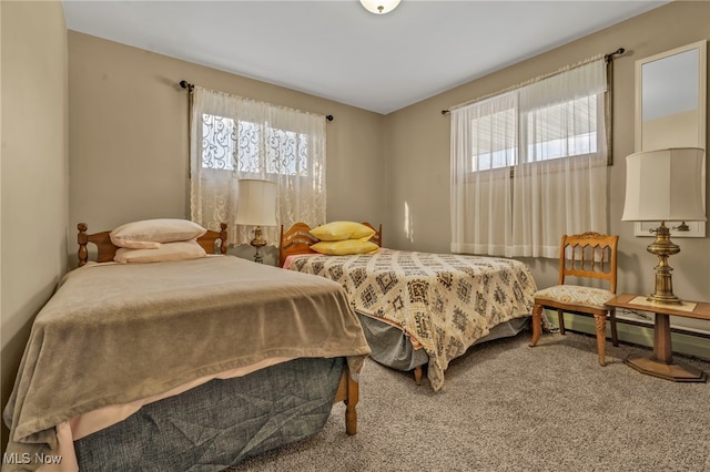 bedroom featuring carpet and a baseboard radiator