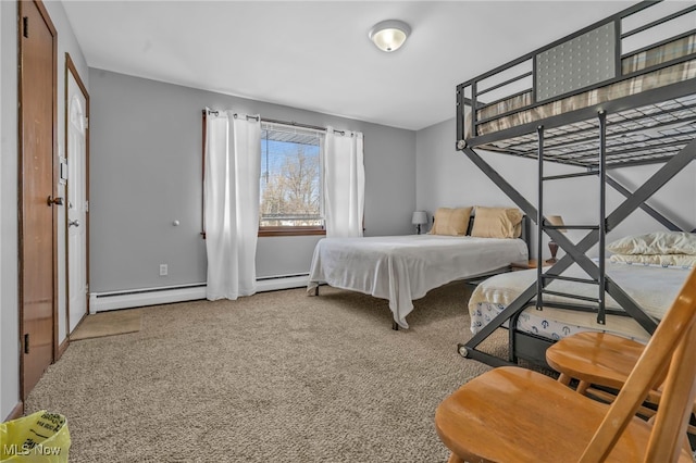 carpeted bedroom featuring a baseboard heating unit