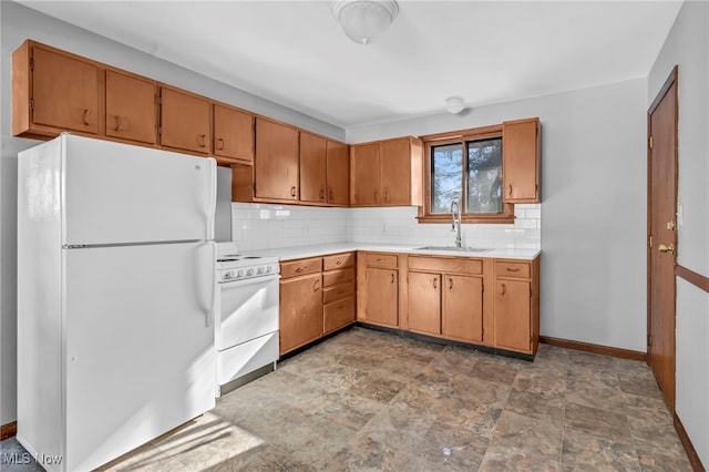 kitchen featuring tasteful backsplash, sink, and white appliances