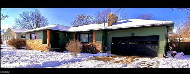 ranch-style home featuring a garage