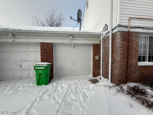 view of snow covered garage