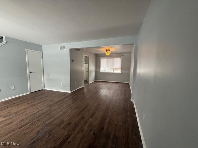 empty room featuring dark wood-type flooring