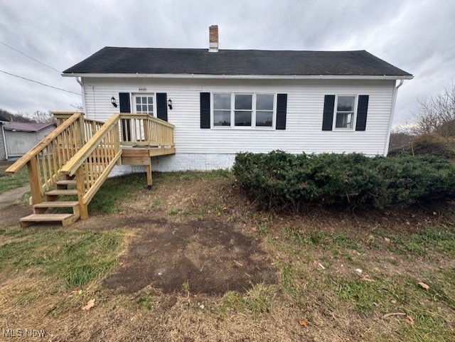 rear view of property with a deck