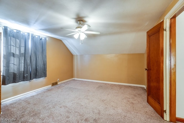 additional living space featuring ceiling fan, carpet flooring, and lofted ceiling