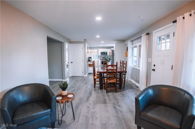 dining space featuring hardwood / wood-style flooring