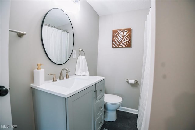 bathroom with toilet and vanity