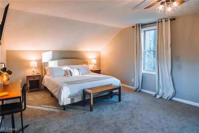 carpeted bedroom with ceiling fan and vaulted ceiling