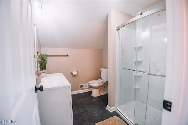 bathroom with a shower with door, toilet, vanity, and lofted ceiling