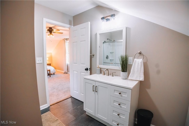 bathroom with vanity, ceiling fan, tile patterned floors, and a shower with door