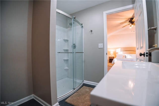 bathroom featuring walk in shower and ceiling fan