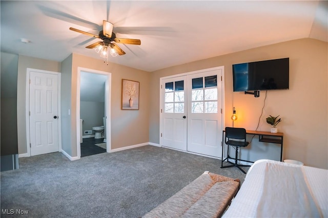 sitting room featuring ceiling fan, dark carpet, and vaulted ceiling