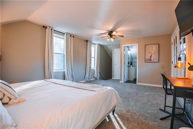 carpeted bedroom featuring ceiling fan, ensuite bath, and vaulted ceiling