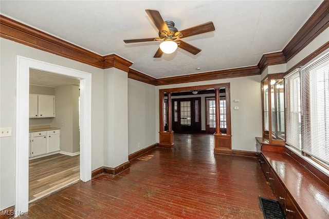 hall with crown molding and dark hardwood / wood-style floors