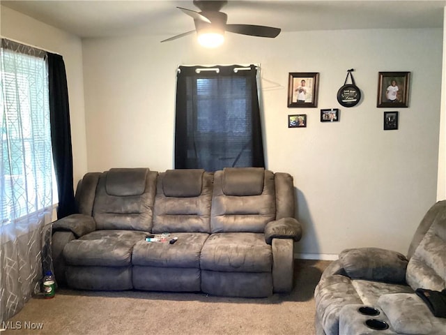 living room featuring ceiling fan and light colored carpet