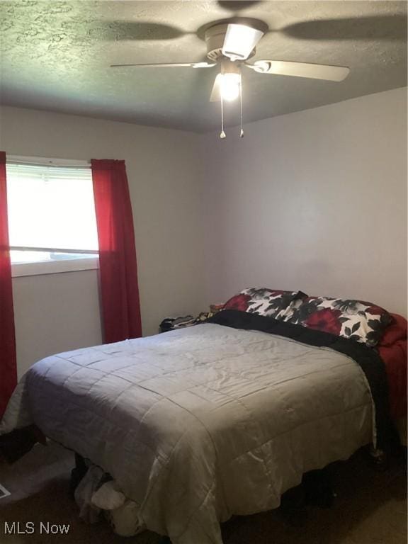 bedroom featuring ceiling fan