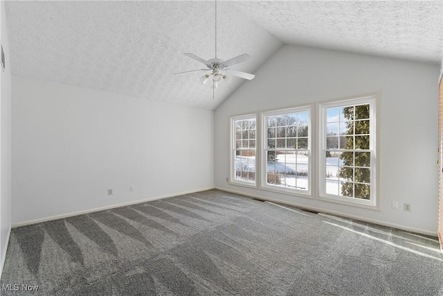 carpeted spare room featuring ceiling fan, a textured ceiling, and lofted ceiling