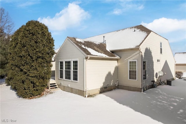 view of snow covered house