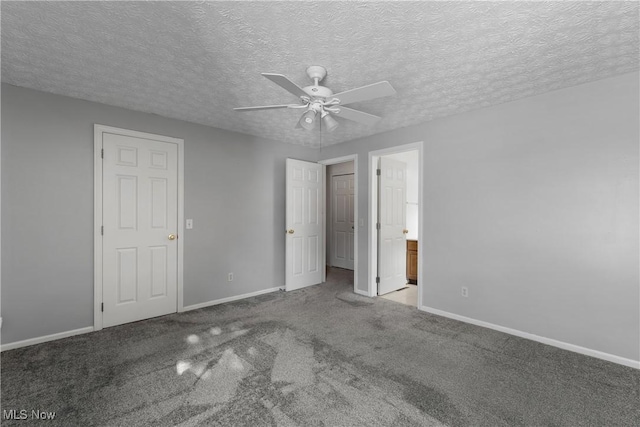 unfurnished bedroom with light carpet, ceiling fan, ensuite bathroom, and a textured ceiling