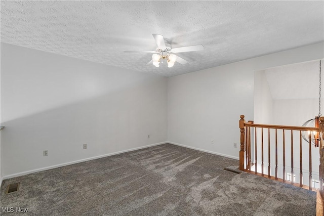 2834 Caxton Cir, Akron, OH 44312 - carpeted spare room featuring baseboards, visible vents, a textured ceiling, and ceiling fan