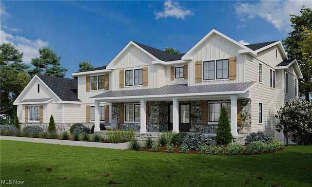 view of front of home with covered porch and a front yard