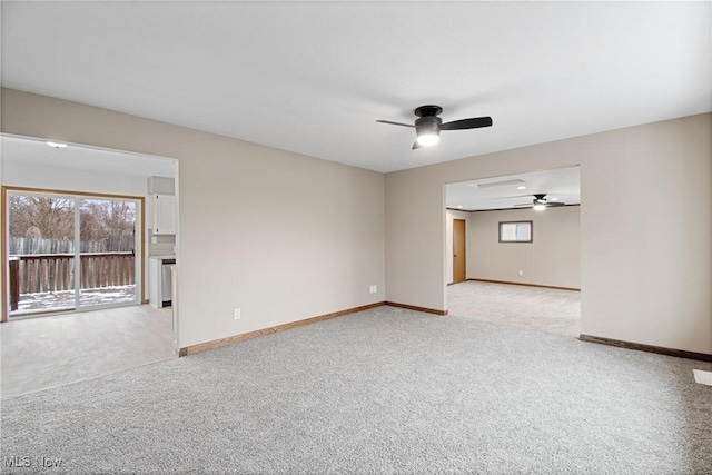 carpeted empty room featuring ceiling fan and a healthy amount of sunlight