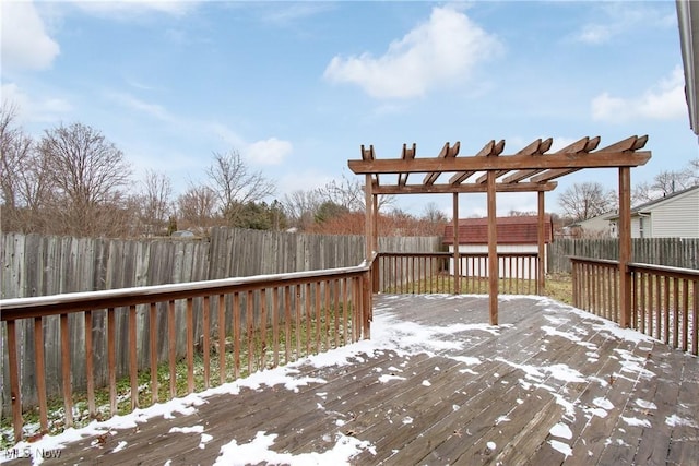 snow covered deck with a pergola